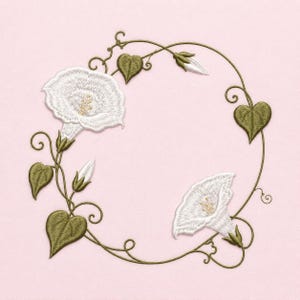 May include: An embroidery design featuring a circular vine frame with olive green stems and heart-shaped leaves. Two white morning glory flowers with yellow centers are positioned on the left and bottom right, accompanied by two closed buds.