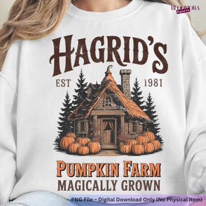 May include: White sweatshirt with a graphic of Hagrid's hut, pumpkins, and the text "Hagrid's Pumpkin Farm Magically Grown." The design includes the text "EST 1981".