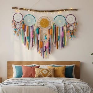 May include: A bedroom scene featuring a wooden bed frame with a beige comforter and pillows. Above the bed hangs a large dreamcatcher with colorful ribbons and feathers. A round jute rug sits on the floor, and a potted plant is in the corner.