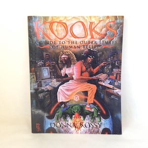 May include: A paperback book titled "KOOKS" with the subtitle "A Guide to the Outer Limits of Human Belief." The cover art features a surreal illustration of two figures, one blindfolded, with computers and a globe.