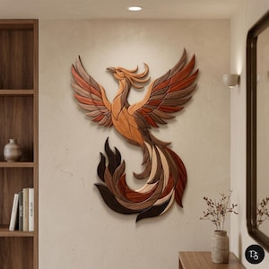 May include: A wooden phoenix wall art piece with outstretched wings, crafted from various shades of brown and reddish-brown wood. The bird's tail feathers cascade downwards. The artwork is mounted on a neutral-colored wall, creating a striking contrast.
