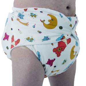 May include: White diaper featuring a colourful pattern of cartoon bears, moons, stars, and other playful designs. The diaper has a wrap-around style with a secure closure for a comfortable fit.
