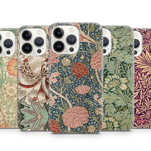 May include: Five phone cases with floral patterns. The cases feature various designs with flowers and leaves in shades of pink, red, green, and cream. The cases are designed to fit a smartphone.