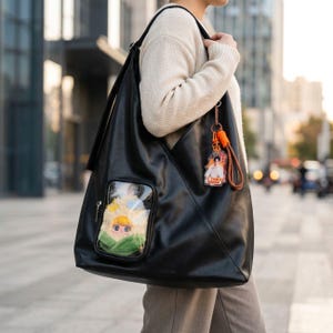 crossbody tote bags for travel Made From 100% Recycled Plastic Stash It Bag Midnight in Hollywood water bottle The 13 Best Travel Tote