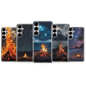 May include: Five phone cases with bonfire scenes. Each case displays a different landscape, including a starry night, ocean, and beach. The bonfires are depicted with orange and yellow flames, creating a warm contrast.