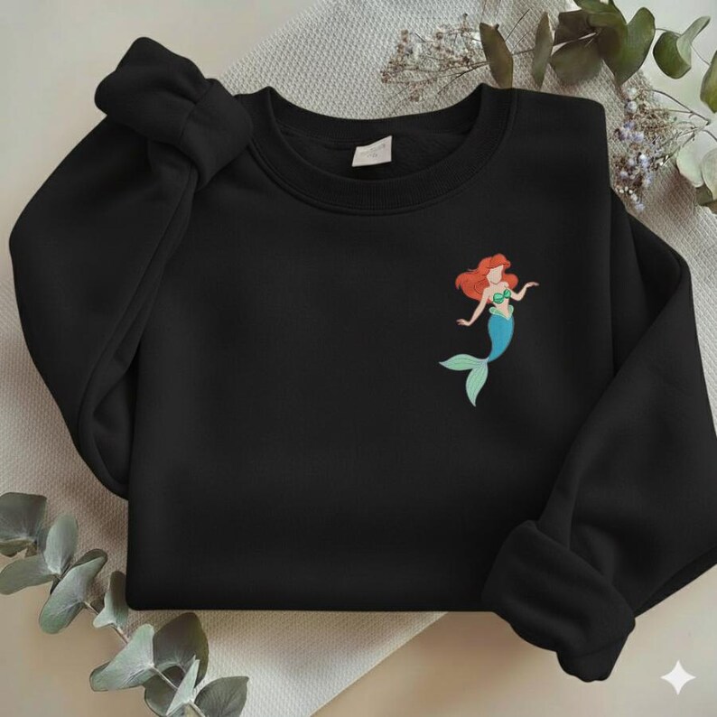 May include: A white ceramic mug with a black handle and the text "But First, Coffee" in a black, bold font. The mug is likely 11-15 ounces and is suitable for hot beverages.