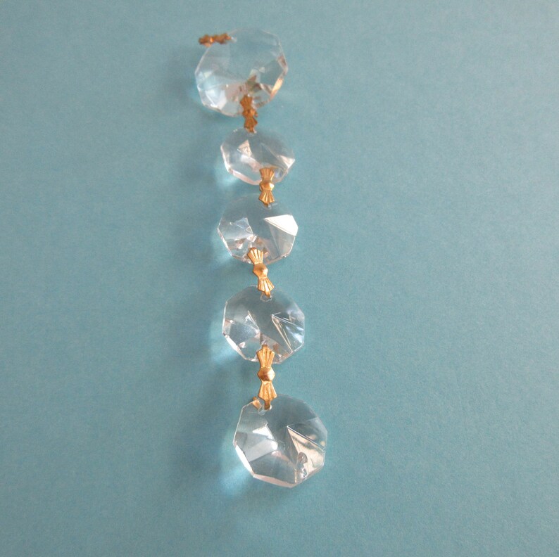 Crystal Octagon Prisms Graduated 1 Inch to 5/8 Inch Hanging Gold Bowtie