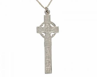 May include: Silver Celtic cross pendant necklace with intricate details and a long, slender design.