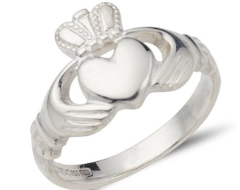 May include: A silver Claddagh ring with a heart, two hands, and a crown on top.
