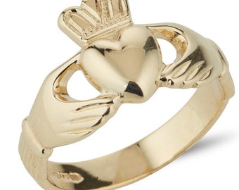May include: A gold Claddagh ring with a heart, hands, and crown design.