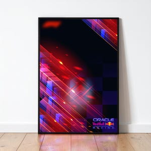 Op de afbeelding: Een ingelijste poster met een dynamisch abstract ontwerp in rood, blauw en paars. Diagonale lijnen en geometrische vormen creëren een gevoel van snelheid. Het Oracle Red Bull Racing logo staat onderaan.