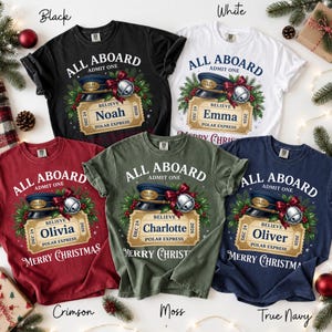 May include: Five short-sleeve t-shirts in black, white, crimson, moss, and navy blue. Each shirt features a graphic of a train conductor hat, a silver bell, and a golden ticket with the text All Aboard, Admit One, Believe, and Polar Express.