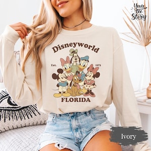 May include: A set of three ceramic mugs with a speckled, matte finish. The mugs are in shades of cream, light gray, and dark gray. Each mug has a simple, minimalist design, perfect for coffee or tea.