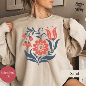 May include: A set of three ceramic mugs with a speckled, matte finish in cream, light grey, and dark grey. Each mug has a simple, minimalist design, ideal for coffee or tea.