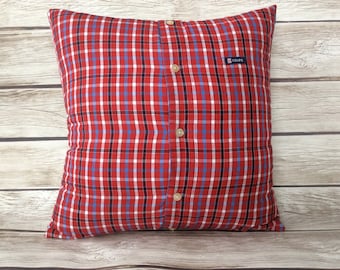 May include: Red and blue plaid pillow with a button closure and a "CHAPS" label.