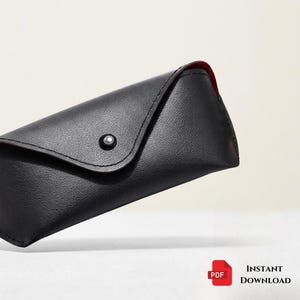 May include: Black leather eyeglasses case with a red interior. The case has a snap closure and a minimalist design. The logo "HUSTEBYTRADE" is visible in the upper left corner. The words "INSTANT DOWNLOAD" are in the lower right corner.
