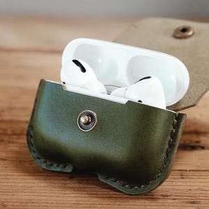 May include: A set of three ceramic mugs with a speckled, matte finish. The mugs are in shades of cream, light gray, and dark gray. Each mug has a simple, minimalist design, perfect for coffee or tea.
