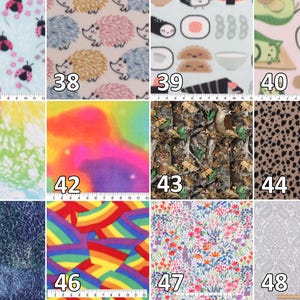 May include: A grid of twelve fabric swatches labeled 37 through 48, featuring patterns including ladybugs, hedgehogs, sushi, cats, tie-dye, camouflage, leopard print, abstract swirls, rainbows, floral prints, and a gray damask design.