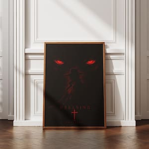 May include: A rectangular framed poster featuring a dark black background with a silhouette of a figure wearing a wide-brimmed hat. Two glowing red eyes are visible above the figure, and the word HELLSING is printed in red above a red cross.