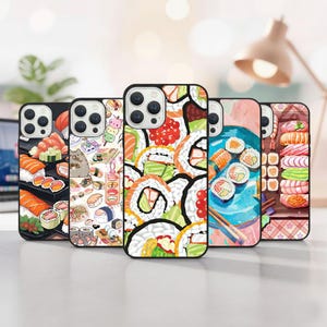 May include: A collection of phone cases with sushi-themed designs. The cases feature various sushi rolls, nigiri, and other Japanese food illustrations in vibrant colors. The cases have black borders and are displayed on a white surface.