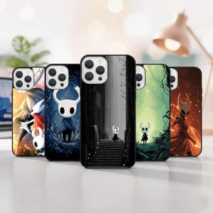 May include: A collection of phone cases featuring various designs from the video game Hollow Knight. The cases display colorful artwork of characters and scenes, including a black and white image of a character on stairs.
