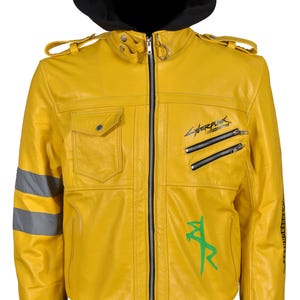 May include: A bright yellow leather jacket with a black hood. The jacket features a zip-up front, multiple pockets, and the word "Cyberpunk" printed on the chest. It has a green graphic and reflective stripes on the sleeves.