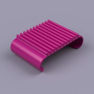 May include: A magenta-colored, curved, ribbed object. The object has a series of parallel ridges across its top surface. The ends of the object curve upwards. The background is a light purple color.