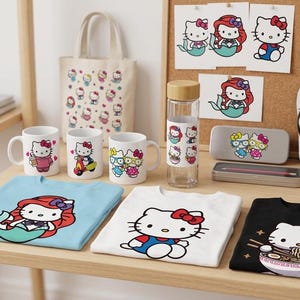 May include: A collection of Hello Kitty themed merchandise, including mugs, shirts, a tote bag, water bottle, and flip-flops. The items feature various Hello Kitty designs, including mermaid and ramen themes. The products are arranged on a wooden table.