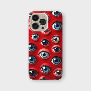 May include: A red phone case with a repeating pattern of eyes. The eyes have blue irises and black pupils, set against a vibrant red background. The case has a glossy finish and a camera cutout.