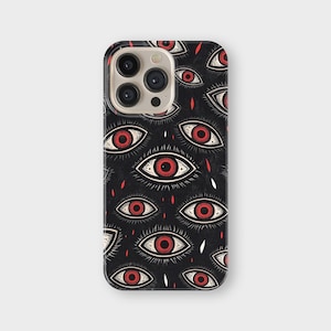 May include: Black phone case with a repeating pattern of stylized red eyes and white details. The design includes red tear-shaped elements. The case has a glossy finish and a camera cutout.