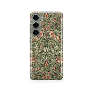 May include: A phone case with a detailed floral and bird pattern in shades of green, red, and cream. The design features stylized birds and flowers, creating a vintage aesthetic. The case has a glossy finish and a camera cutout.