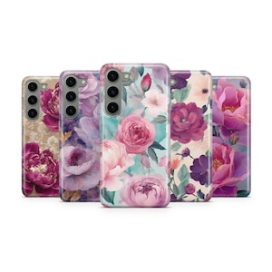 May include: A collection of floral phone cases. Each case features a different watercolor design of roses and peonies in shades of pink, purple, and cream. The cases have a glossy finish and a camera cutout.