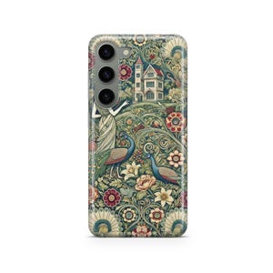 May include: A phone case featuring a detailed floral and peacock design. The case has a dark green background with colorful flowers, two peacocks, and a building. The design is reminiscent of vintage art.