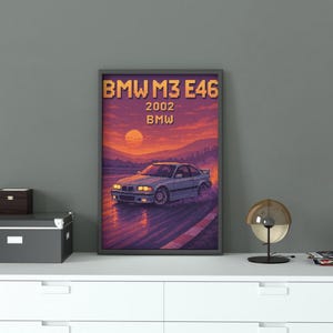 May include: Framed art print featuring a pixelated illustration of a BMW M3 E46 car. The artwork showcases the car on a road with a sunset backdrop. The text "BMW M3 E46 2002 BMW" is displayed at the top.