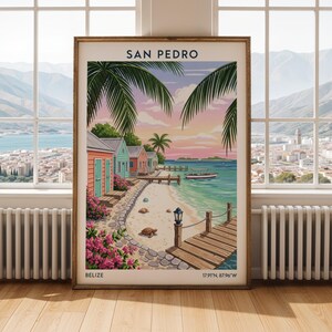 May include: A framed art print featuring a colorful beach scene with the text "SAN PEDRO" at the top and "BELIZE" at the bottom. The artwork depicts pastel-colored beach huts, palm trees, a wooden pier, and a boat on the turquoise water.