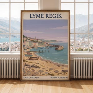May include: A framed travel poster featuring a coastal illustration of Lyme Regis, Dorset, England. The artwork depicts a harbor with small boats, a sandy beach with pebbles and fossils, and town buildings. Text reads: LYME REGIS. DORSET, ENGLAND 50.7260° N, 2.9340° W.