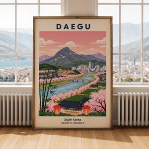 May include: A framed travel poster for Daegu, South Korea, featuring a scenic illustration. The artwork depicts a river, buildings, mountains, and cherry blossoms under a pink and blue sky. The word "DAEGU" is at the top.