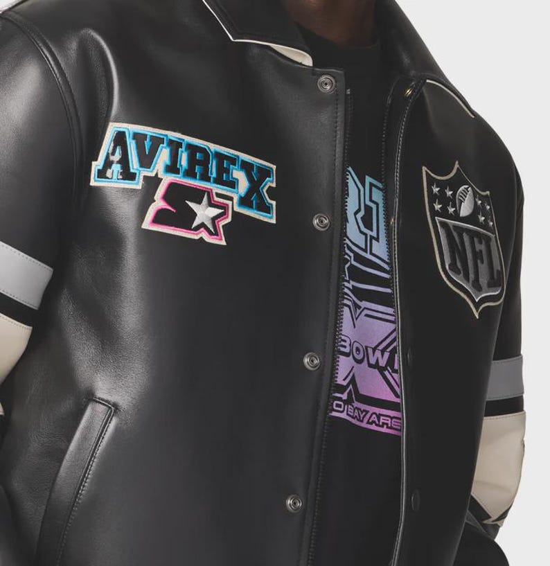 May include: Black leather jacket with white collar and accents. Features the "AVIREX" and "Starter" logos, along with an NFL emblem. The jacket has a snap-button closure and a design on the inner shirt that says "BOW" and "OBEY ARE".