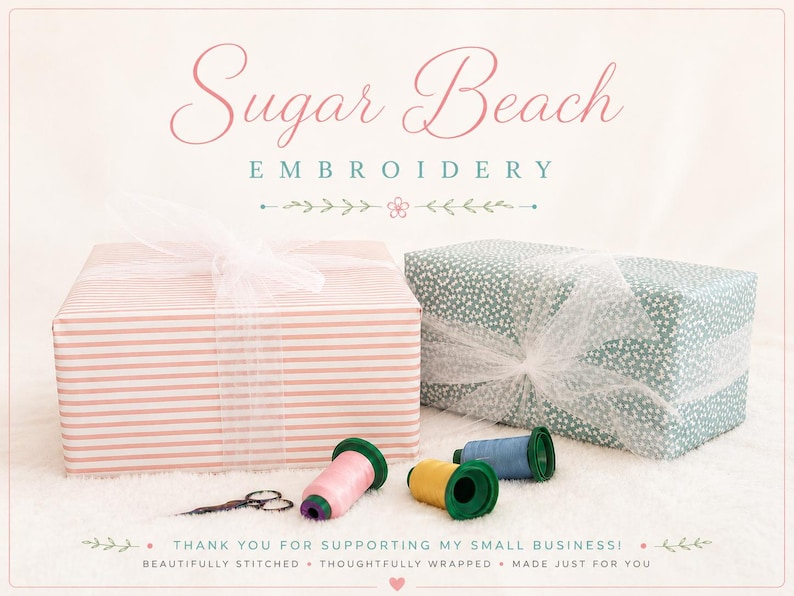 May include: Two rectangular gift boxes wrapped in white tulle ribbon, one with pink stripes and one with a green floral pattern. Three spools of thread in pink, yellow, and blue sit beside a pair of small scissors. Text reads Sugar Beach Embroidery.