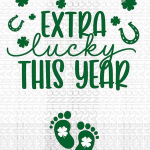 May include: A white background with green text and graphics. The text reads "EXTRA lucky THIS YEAR". There are shamrocks, horseshoes, and footprints with shamrocks inside. A St. Patrick's Day themed design.