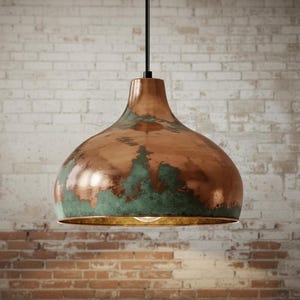 May include: A copper-colored pendant light with a distressed finish, featuring areas of green patina. The light fixture has a bell-shaped shade and a black cord. The background is a brick wall.
