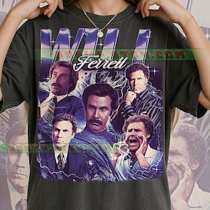 May include: Dark gray t-shirt featuring a collage of Will Ferrell images with the name "Will Ferrell" in a stylized font. The design includes images of the actor in various roles, with a retro, vintage aesthetic.