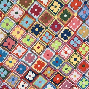 May include: A colorful fabric with a repeating pattern of flowers in various colors, including red, blue, yellow, green, and pink. The flowers are arranged in a diamond pattern on a white background.