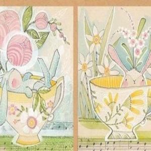 May include: Four watercolor paintings of bunnies in teacups surrounded by flowers. The bunnies are in different poses and the flowers are in various colors. The paintings are on a light brown background.