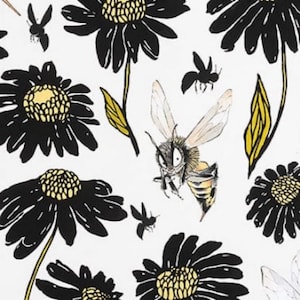 May include: A white background with a black and yellow floral pattern. The flowers have black petals and yellow centers. A bee with black and yellow stripes is flying in the center of the image.