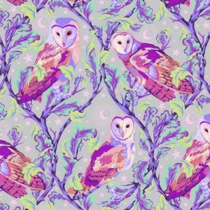 May include: A seamless pattern featuring colourful owls perched on branches with purple and green leaves. The background is a light grey with white stars and crescent moons.