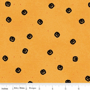 May include: Orange fabric with a repeating pattern of black jack-o'-lantern faces.