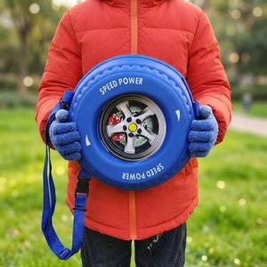 May include: A blue circular backpack designed to resemble a car tire. The backpack features the words "SPEED POWER" in white, a silver wheel design, and a red brake caliper. It has a blue shoulder strap.