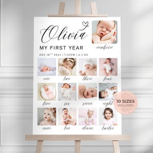 May include: A white sign on an easel with the name "Olivia" in elegant script. It features a collage of baby photos from newborn to twelve months, with the text "MY FIRST YEAR" and "10 SIZES INCLUDED".