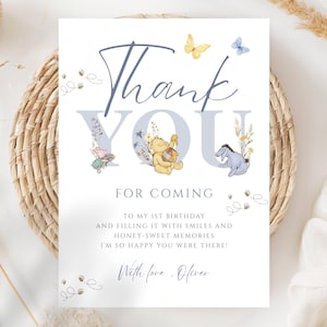 May include: A white card with the words "Thank You" in blue script and block letters. Winnie the Pooh characters and butterflies decorate the card. The text "For Coming" and other text are below the main text.